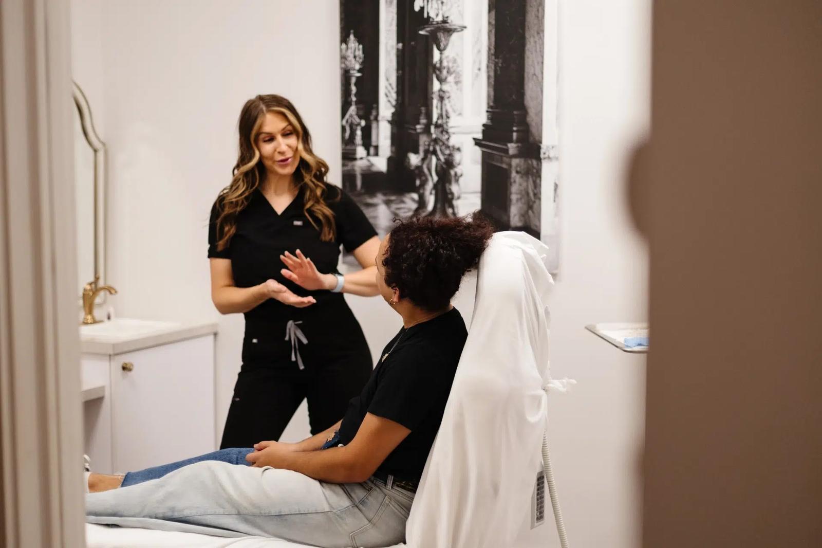 esthetician and patient consultation at artistry of face
