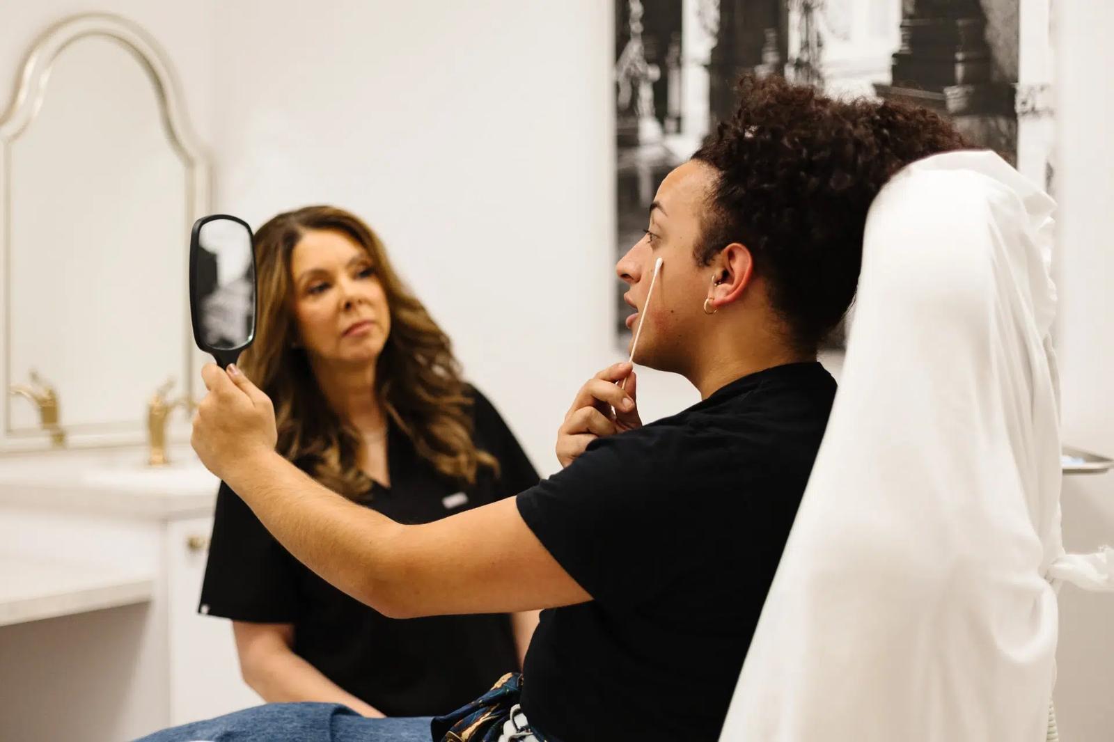 esthetician and patient consultation at artistry of face
